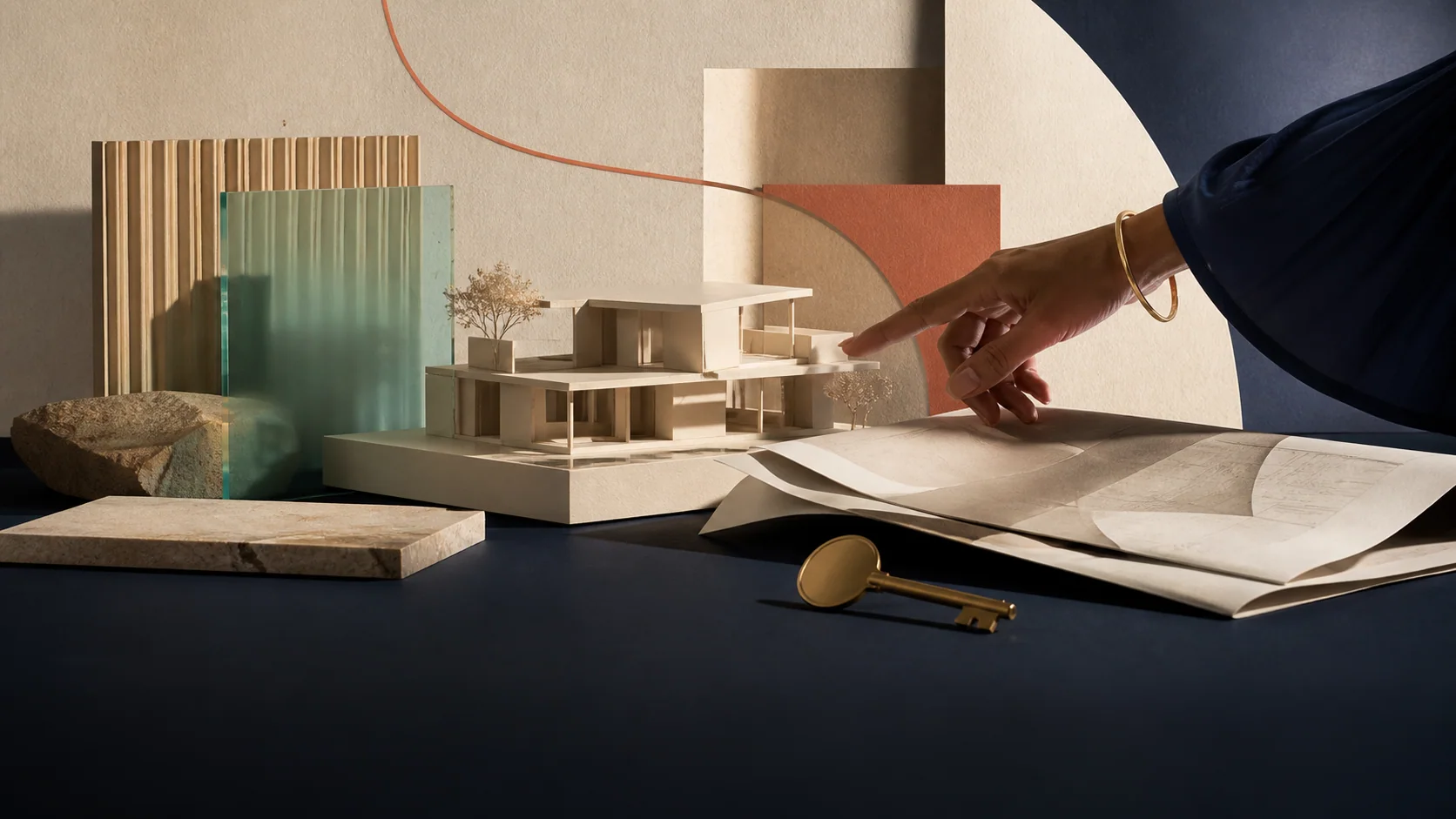 Editorial property campaign with an architectural model, material samples, plans, and a key